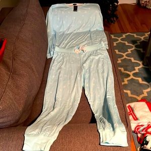 A  large pair of baby blue pajamas with white stars on them.